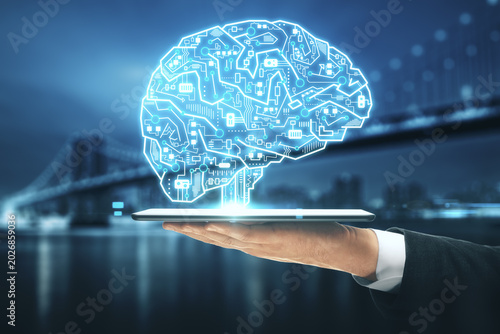 Human hand holding glowing digital brain hologram, artificial intelligence, machine learning, neural network and innovation concept