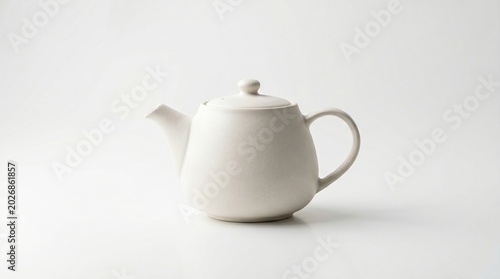 Minimalist ceramic teapot product mockup featuring clean white studio background with soft natural lighting elegant modern design composition commercial advertising style high-end kitchenware presenta