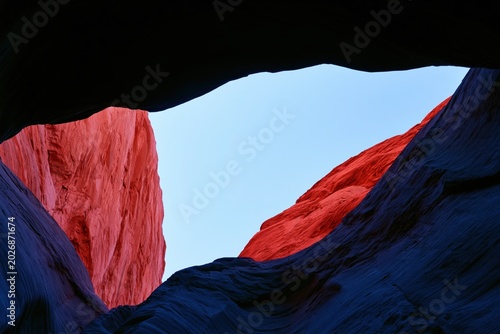 Vibrant Red and Blue Canyon Silhouette with Clear Sky in Natural Frame.