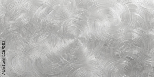 Brushed metal texture with a circular pattern, creating a sophisticated and industrial background for design.