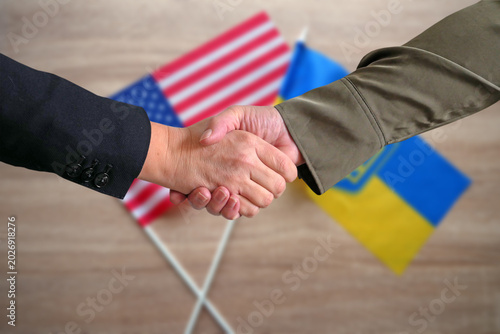 Ukraine and USA Flags and handshake . Mockup.  Partnership, Support and Unity