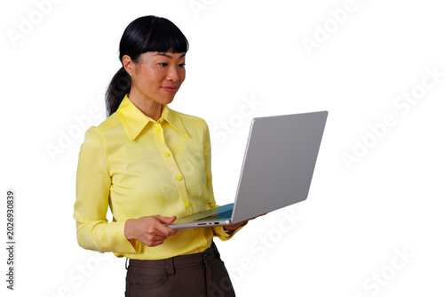 Tableau sur toile Asian businesswoman working with laptop, staying connected, making decisions, us
