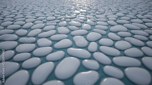 Smooth white pebbles arranged across a serene blue surface illustrating a calming natural background design