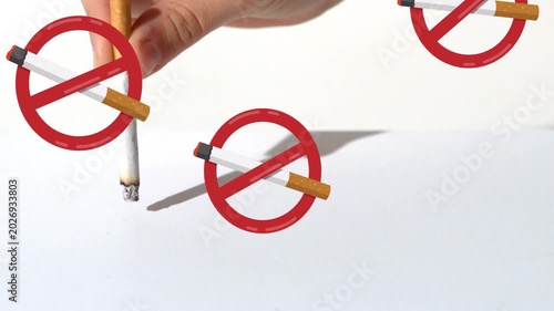 Hand entering, grabbing cigarette, pressing and twisting, putting out as red no-smoking icons float