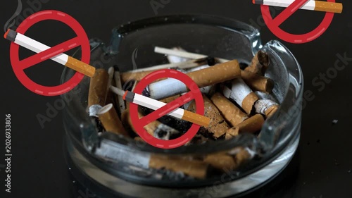 No-smoking icon appearing, icons multiplying and drifting over ashtray, emphasizing ban