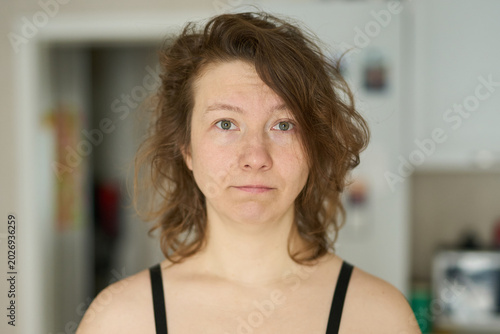 Tableau sur toile Young Woman With Tired Emotional Expression In Home Interior, Natural Appearance, Mental Fatigue, Stress, Burnout And Authentic Everyday Lifestyle Portrait Concept