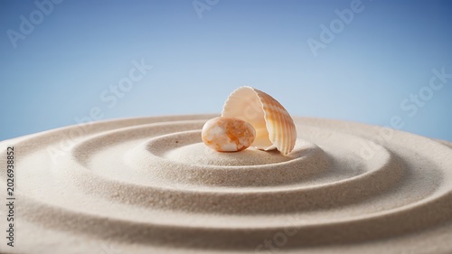 Tranquil zen composition of sand, shell, and stone on a rippled surface with a peaceful blue background
