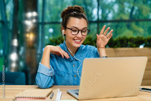 Laptop, young woman for business webinar, virtual training or greeting for productivity lecture. Introduction, office or employee with pc for online engagement, optimization or video call workshop
