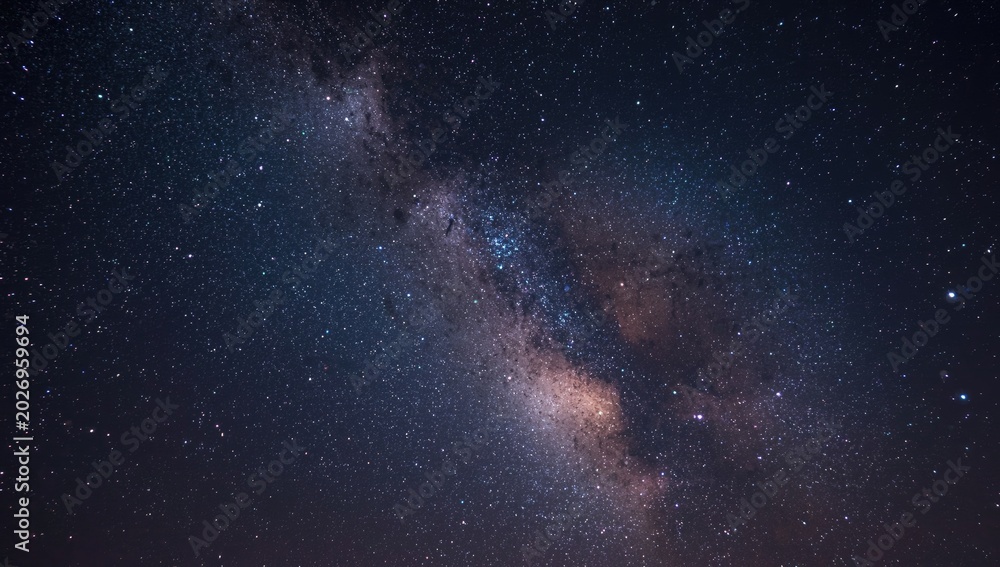 Obraz premium Celestial backdrop with a vibrant Milky Way galaxy and scattered stars