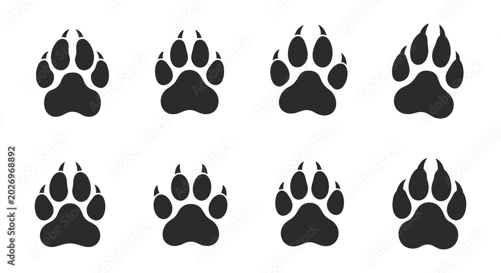 Fototapeta premium Animal paw prints silhouette set on a white background