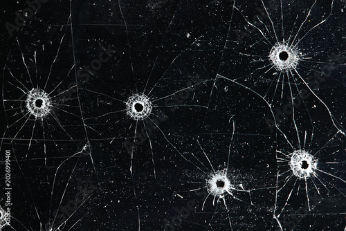 Bullet holes on black glass, overlay design background