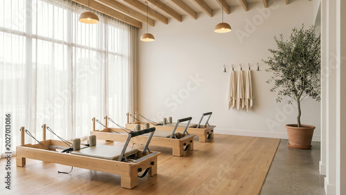 Serene Minimalist Pilates Studio with Wooden Reformers and Sheer Curtains Radiating Wellness and Harmony Perfect for Fitness Branding Lifestyle Advertising and Brochure