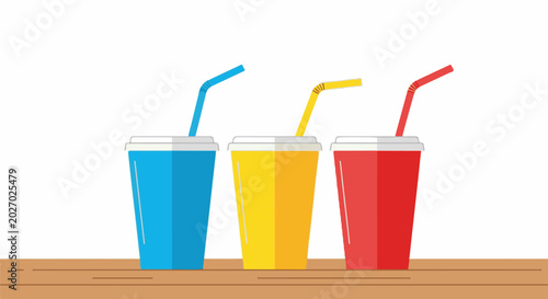 Three colorful cups with straws sit on a wooden surface