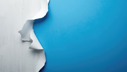 Aged white paint peeling away from blue background with copy space