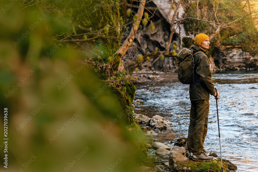 Fototapeta premium Male Hiker Standing by Canyon River