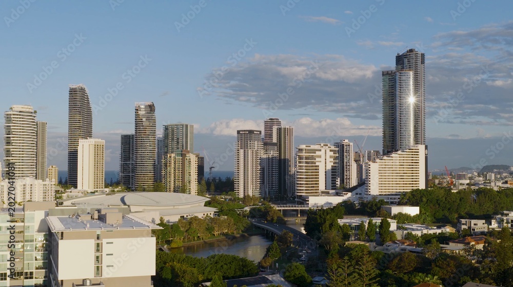 Fototapeta premium Aerial View of Gold Coast Skyline and Waterway at Sunset