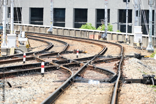 Fotografie Scenery of railway tracks leading to the future through the hustle and bustle of