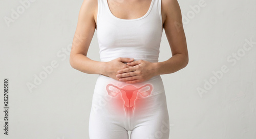 Young woman's body with abdominal pain and highlighted uterus illustration showing adenomyosis disease