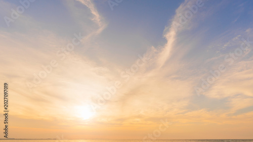 Sunset Sky clouds beautiful Sea in the evening summer season Background, Yellow warm sun dawn,Orange sunrise golden hour, Landscape horizon Colorful nature sun light sea sky cloud,Dusk Sky background