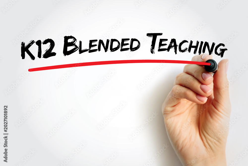 Fototapeta premium K12 Blended Teaching text underlined in red, symbolizing mixed classroom and online education for K12 instructors and learners. Hand holding marker