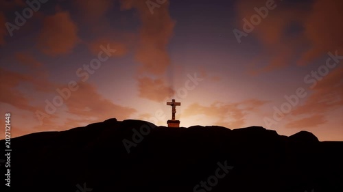 Powerful silhouette of a Christian cross on a rocky hilltop with a glowing sunburst and dramatic cloudy sky. Perfect for Easter, resurrection, faith, religion, and spiritual content.