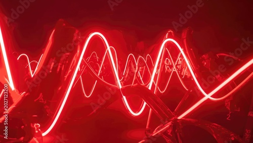 Brilliant neon red illuminated abstract shapes on lively backdrop