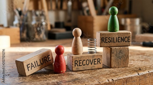 Wooden figures and blocks showing failure recover resilience journey on rustic table