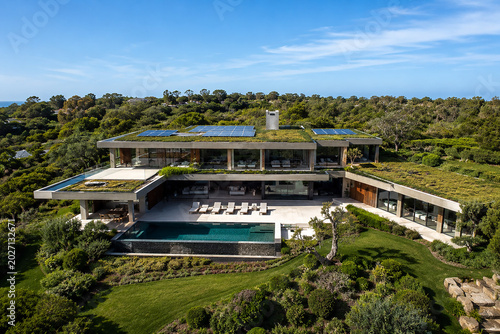 Modern sustainable luxury house with solar energy panels, eco-friendly lifestyle, and smart home technology, high-end residential architecture.