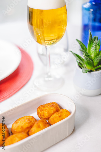 Golden Fried Croquettes with Beer and Modern Table Setting