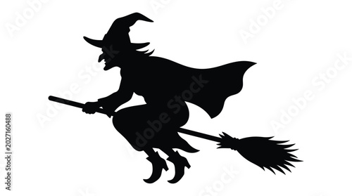 Foto Flying witch on broomstick silhouette