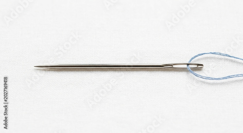 A sewing needle on a white backgroun