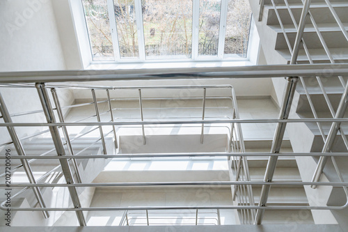 Modern Staircase with Metal Railings in Bright Interior