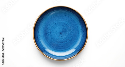 Blue ceramic plate on a clean white background with copy space