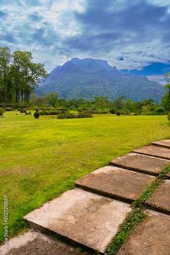 Photos Doi luang Chiang Dao mountain rises behind green garden with stone path under cl