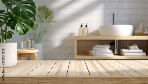 Sunlight illuminates a modern bathroom with plants and clean towels
