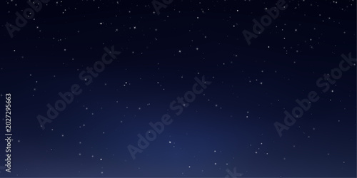 Obraz na płótnie Bright stars scatter across a deep blue sky over rolling hills