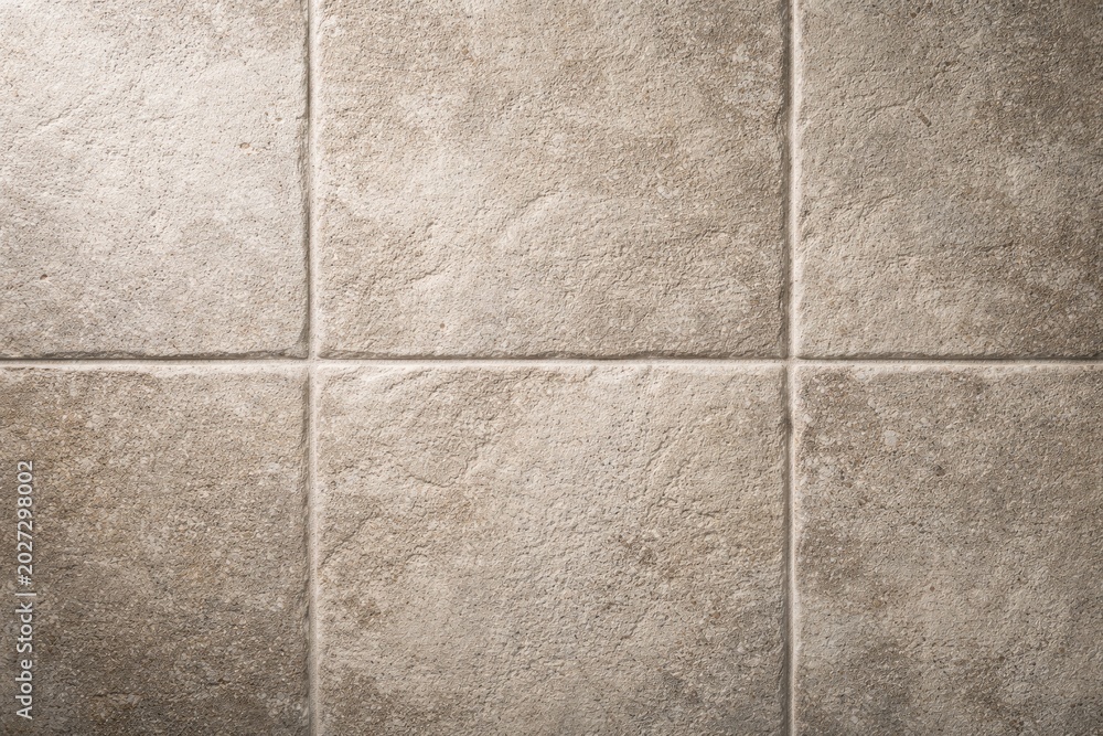 Fototapeta premium Rough textured bathroom tile background ideal for copy space concepts