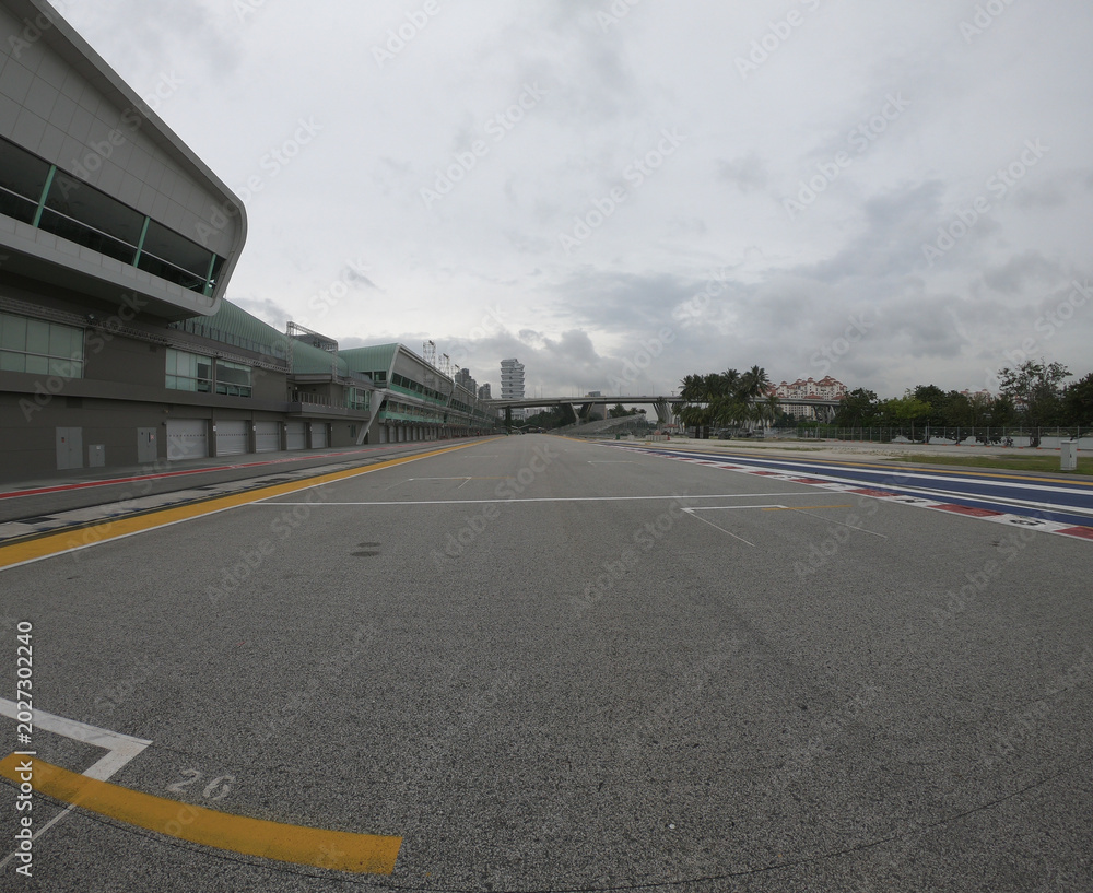 Naklejka premium Singapore / December 2017: Pit lane and start finish line of the Formula One Racing track at Marina Bay Street Circuit. 