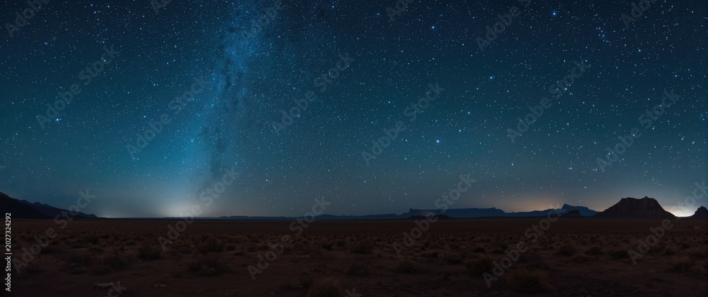 Fototapeta premium clear starry night sky with vast desert terrain