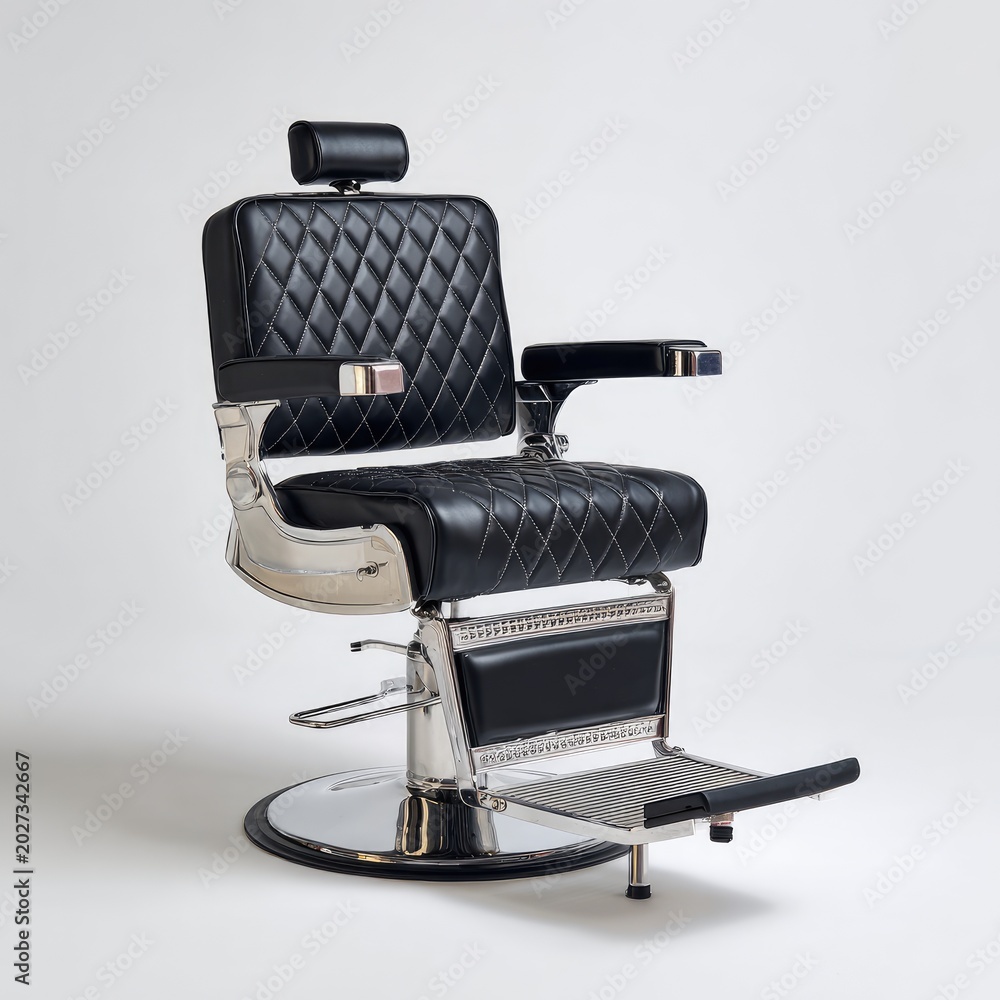 Fototapeta premium A plush black barber chair with diamond stitching and polished chrome details