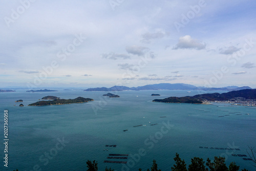 Bild auf Leinwand Panoramic aerial view of small islands and aquaculture rafts in Seto Inland Sea