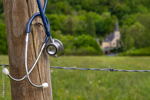Fotografija SThe concept of a medical desert, a shortage of rural doctorstethoscope Hangs by