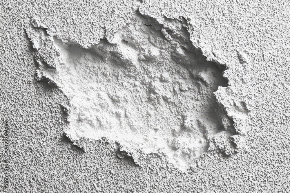 Obraz premium Rough, textured surface with a large, irregular void revealing underlying texture