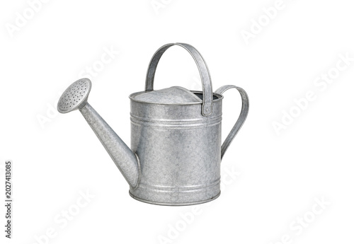 Vintage galvanized metal watering can with long spout and sprinkler head isolated on white background. Classic gardening tool for watering flowers and plants with copy space.