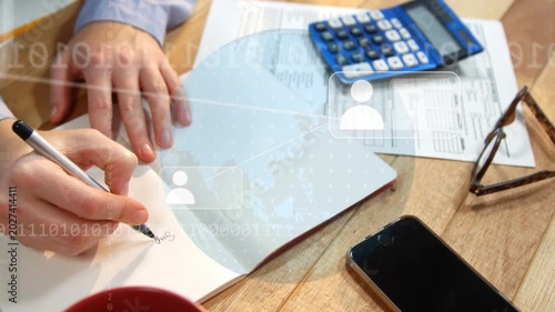 Right hand picking pen and writing, left hand steadying notebook, overlays fading, recording totals