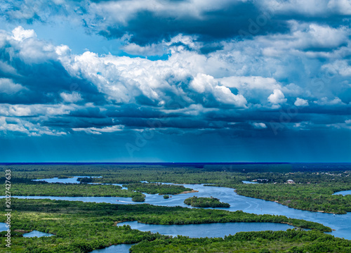 Bilde på lerret aerial drone shot of landscape, river and approaching storm