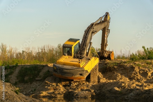Horizontal photo of a modern excavator at work