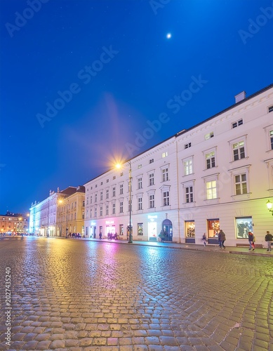 Old Town Square at Night with Illuminated Historical Buildings in Warsaw.