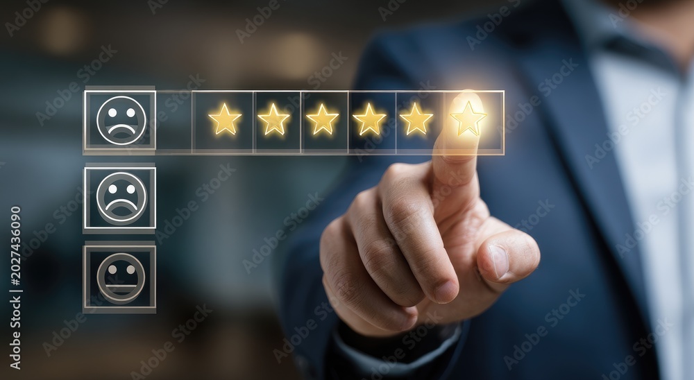 Obraz premium Person selects a star from a rating scale, indicating satisfaction
