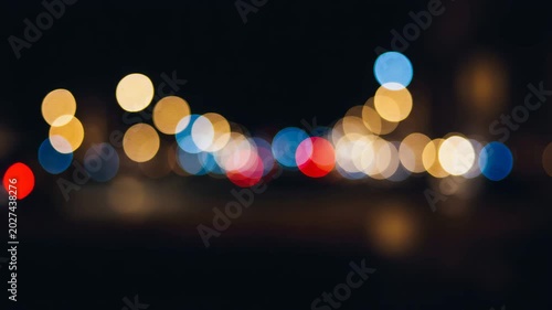 Abstract night city lights in bokeh effect with colorful hues  